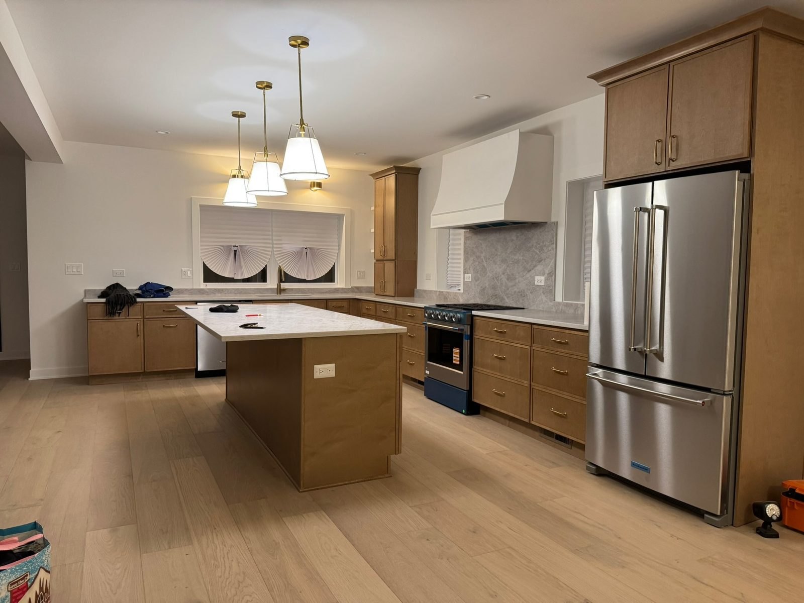 A Pensacola Avenue kitchen we built: white oak island, plaster hood and a range under it